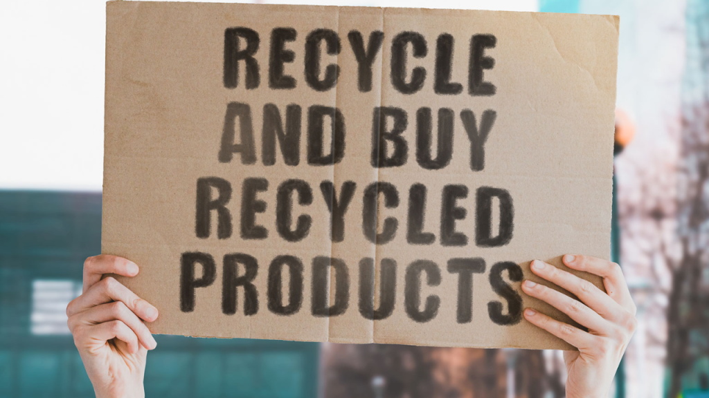 A sign that says recycle and buy recycled products